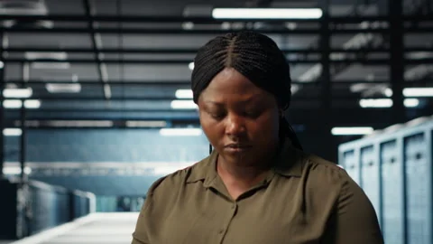 Close up of admin working in data center optimizing network infrastructure Stock Footage 317125280