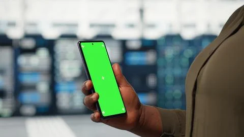 Close up of admin working in data center using isolated screen smartphone Stock Photos