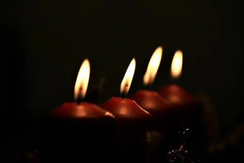 Close up of an Advent arrangement with four burning candles Stock Photos