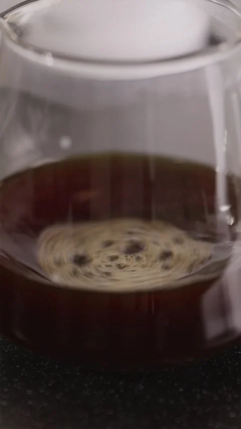 Close-up of aerating coffee in glass server with bubbles Stock Footage 332720151