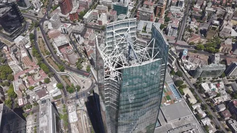 Close-up aerial drone view orbiting the structural steel crown and roof of the Stock Footage 328158048