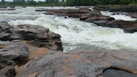 Close up aerial of flow of river water passing through the rocks. Stock Footage 285429366