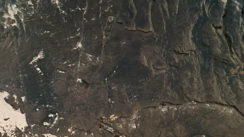 Close up  Aerial footage looking down as waves crash on bedrock on the Stock Footage 245486823