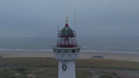 Close Up Aerial of Lighthouse Overlooking Calm Sea Stock Footage 322992779