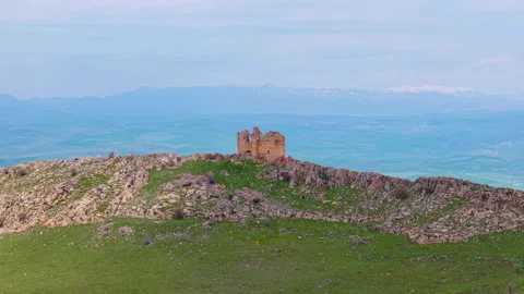 Close Aerial Pass Along an Ancient Cliffside Monastery Above a Steep Gorge Stock Footage 340905702