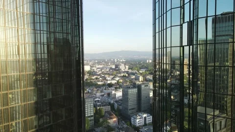 Close aerial passage between reflective Frankfurt towers Stock Footage 331880469