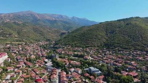 Close aerial pull out view of Rila town with red tile roofs in Bulgaria Stock Footage 345838124