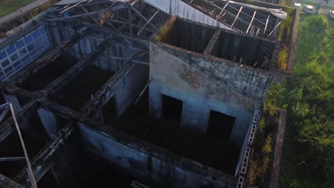 Close aerial of a ruined building with a missing rooftop. Stock Footage 320157486