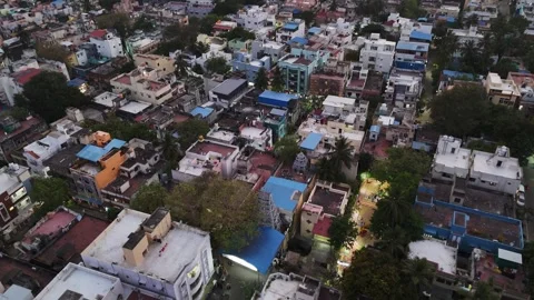 This close-up aerial shot captures a dense patchwork of colorful rooftops and Stock Footage 315765150