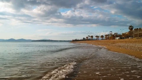 Close up aerial shot flying down a beach in Athens Greece. Waves crashing Video stock 96433455