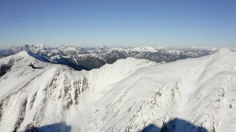 Close-up Aerial Shot of Snow-Capped Rugged Mountain Slopes Stock Footage 332010328