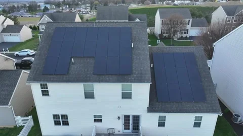Close up aerial shot of solar panel array on roof of large American home. Stock Footage 243347494