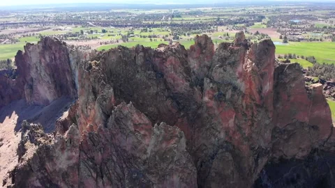 CLOSE-UP AERIAL OF SMITH ROCK IN SMITH ROCK STATE PARK IN CENTRAL OREGON Stock Footage 151060596
