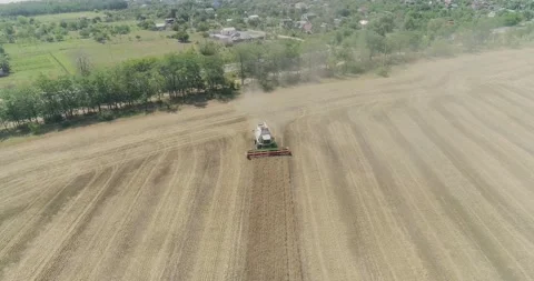 Close-up Aerial view 4k resolution Modern combine harvester collects ripe wheat Stock Footage 134177425