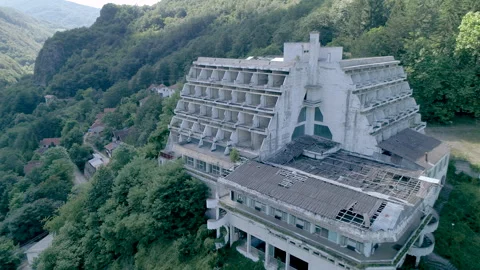 Close Aerial View of Abandoned Mountain Resort Hotel Stock Footage 340358380