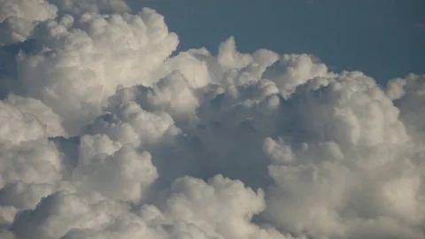 Close Up - Aerial View From Airplane Storm Clouds Blue Sky At High Altitude Stock Footage 80715920