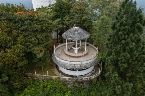 Close-up aerial view of a circular multi-tiered concrete pavilion gazebo Stock Photos