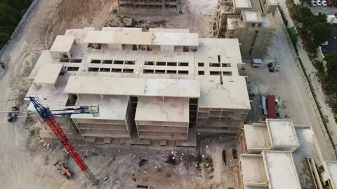 Close up aerial view of construction site, bustling tourist, towering crane Stock Footage 272258983