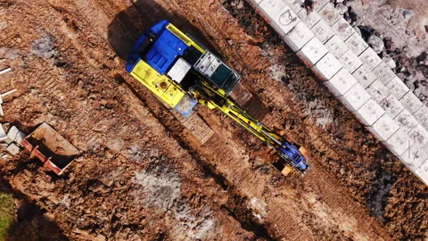 Close up aerial view of excavator on construction site 스톡 동영상 333839571