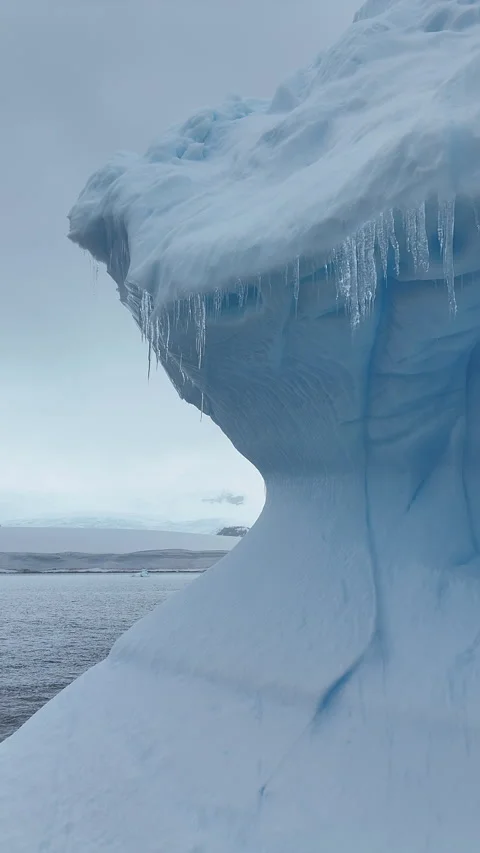 Close up aerial view of an iceberg floating in antarctica Stock Footage 322004102