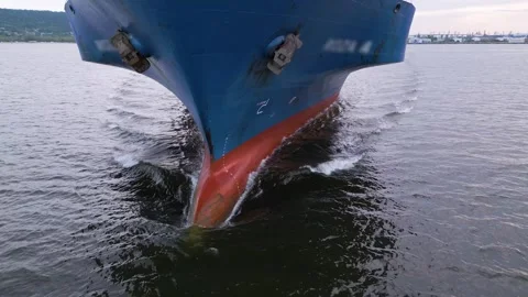 Close-up aerial view of a large cargo ship s bow cutting through the water Stock Footage 309908145