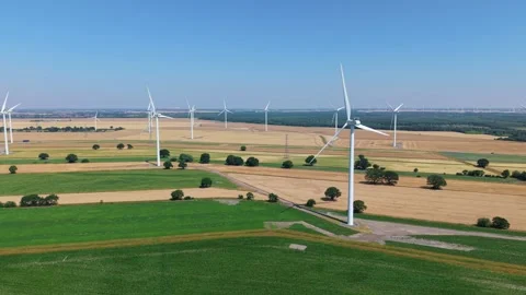 Close-Up Aerial View of Large Onshore Wind Farm and Renewable Power Turbines Stock Footage 341475396