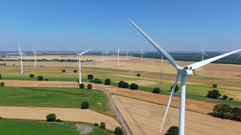 Close-Up Aerial View of Large Onshore Wind Farm and Renewable Power Turbines Stock Footage 341475411