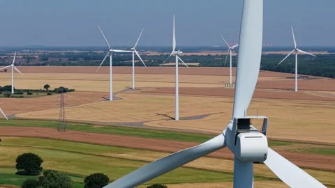 Close-Up Aerial View of Large Onshore Wind Farm and Renewable Power Turbines Stock Footage 341475416