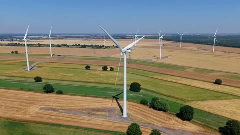 Close-Up Aerial View of Large Onshore Wind Farm and Renewable Power Turbines Stock Footage 341475424