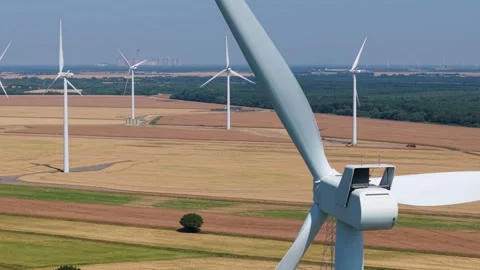 Close-Up Aerial View of Large Onshore Wind Farm and Renewable Power Turbines Stock Footage 341475451