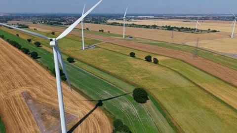 Close-Up Aerial View of Large Onshore Wind Farm and Renewable Power Turbines Stock Footage 341475479