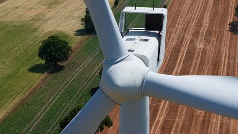 Close-Up Aerial View of Large Onshore Wind Farm and Renewable Power Turbines Stock Footage 341475495