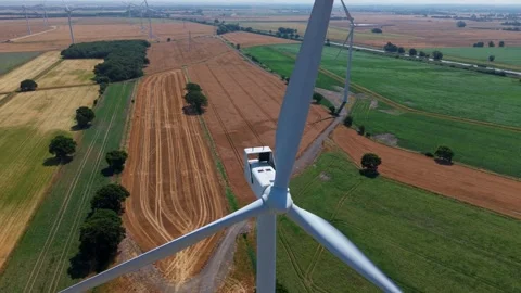 Close-Up Aerial View of Large Onshore Wind Farm and Renewable Power Turbines Stock Footage 341475497