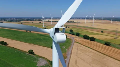 Close-Up Aerial View of Large Onshore Wind Farm and Renewable Power Turbines Stock Footage 341475599