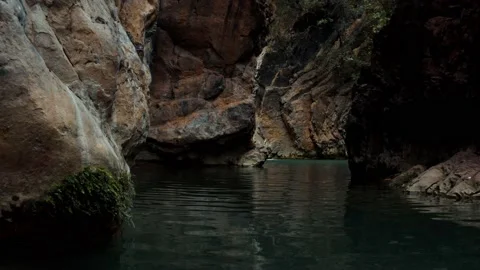 Close aerial view of a river in between the mountains Stock Footage 172059039