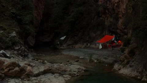 Close aerial view of a river in between the mountains Stock Footage 172059330