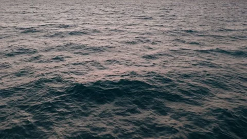 Close aerial view of rolling blue ocean waves in the Ionian Sea at dusk. Stock Footage 340928056