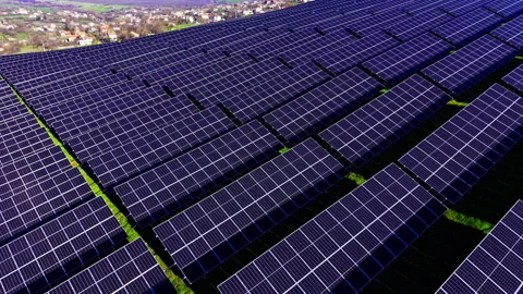 Close up aerial view of solar panel rows in power plant Stock Footage 334318453