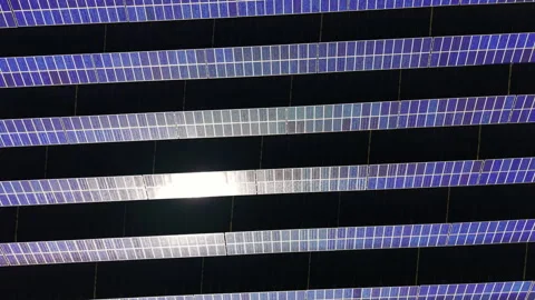 Close aerial view of solar panel rows with sun glare reflection, Bulgaria Stock Footage 335689696