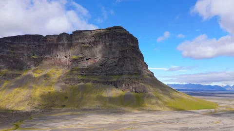 Close-Up Aerial View of Towering Cliff on Icelandic Plateau Highlighting Rugged Stock Footage 275486436