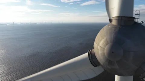Close up aerial view of wind turbine blades rotating offshore Video stock 334118980
