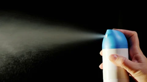 A close-up of an aerosol can. Spray spray on a black background Stock Footage 85426035