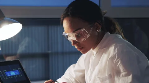 Close up of african american engineer in protective glasses working in Stock Footage 155812293