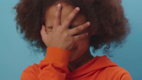 Close up of African American kid makes face palm gesture expressing disbelief Stock Footage 167005932