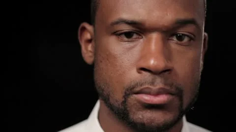 Close up of African American man's face, dolly shot Stock Footage