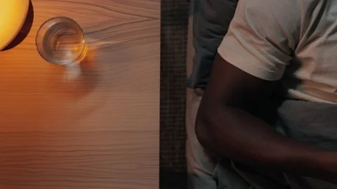 Close up of african americanman using mobile with green screen in bed Stock Footage 162734697