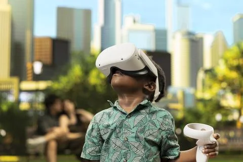Close up of african boy with virtual reality glasses standing in city park Stock Photos
