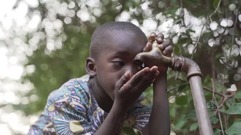 Close-Up African Drinking Boy Stock Footage 97063335
