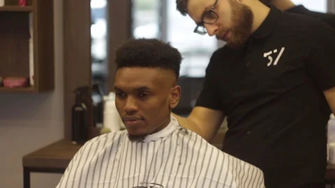 Close up of african hair in barbershop. Stylish barber making a new haircut. Stock Footage