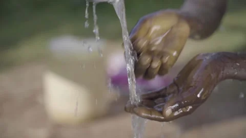 Close African hands drinking water Stock Footage 231525662